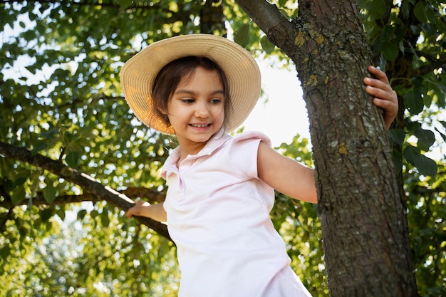 Young girl spending time outdoors in a rural area enjoying childhood