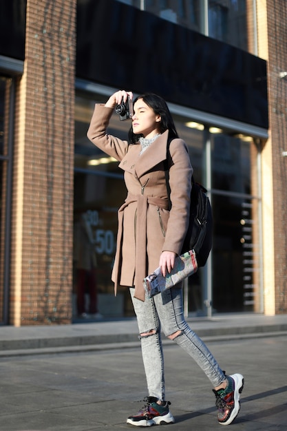 Young girl tourist walks around the city