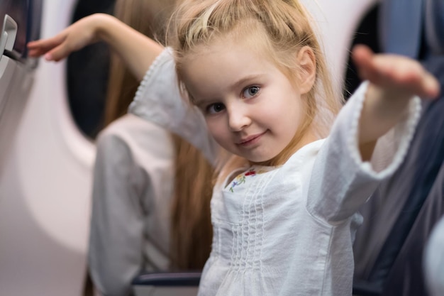 Young girl travelling by plane