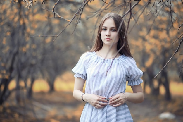 Young girl on a walk in the autumn