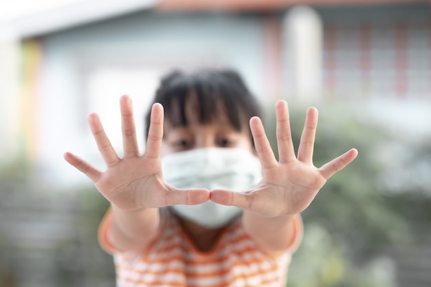 Young girl wearing masks to prevent disease