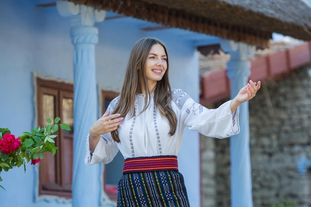 young girl wearing Romanian traditional blouse in the country Authentic national costume