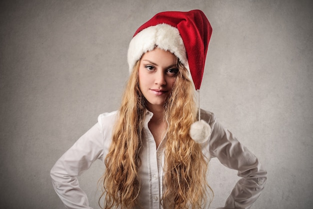 Young girl wearing Santa hat