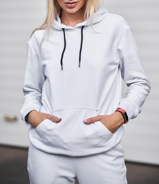 Young girl wears white fleece hoodie Mockup for clothing line design and logo placement