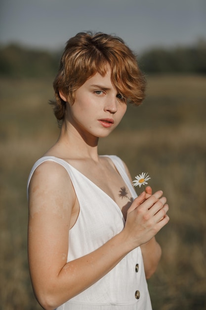 Young girl in white dress countryside portrait of a woman