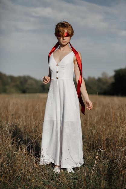 Young girl in white dress countryside portrait of a woman