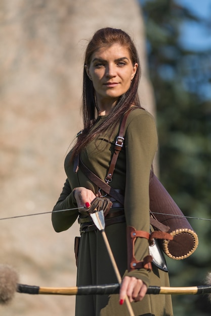 Young girl with arrows and bow