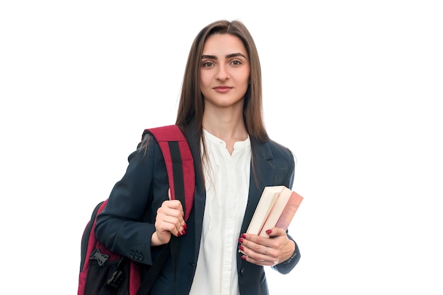 Young girl with books and bag isolated on white