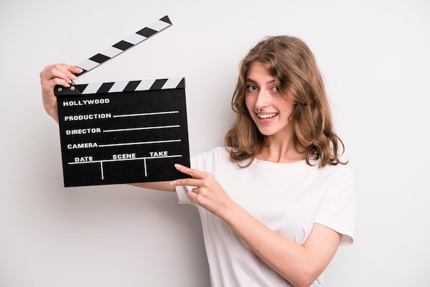 Young girl with a cinema clapper film or movie concept