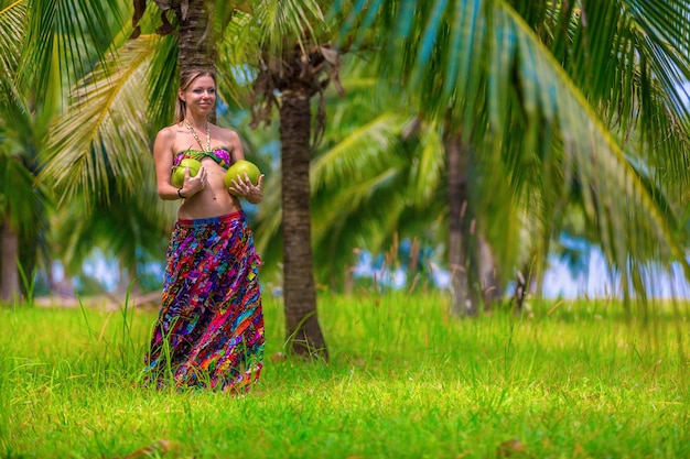 Young girl with coconuts