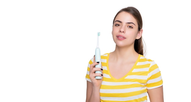 Young girl with electric toothbrush isolated on white background