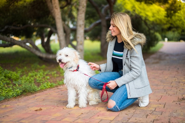 Young girl with her dog in a park