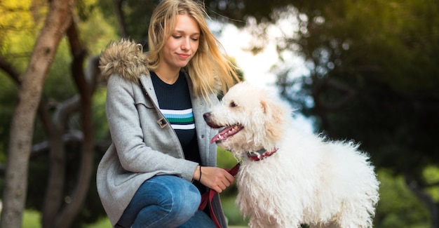 Young girl with her dog in a park