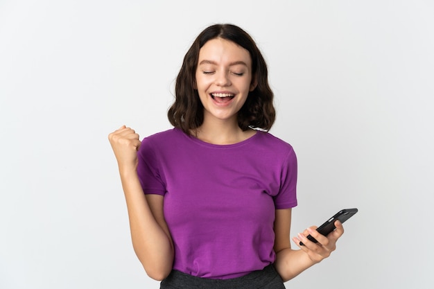 Young girl with phone on isolated white