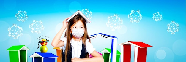 Young girl with protection mask against corona virus at school