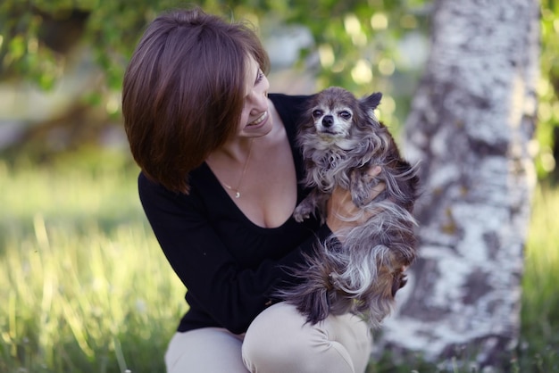 young girl with a small dog