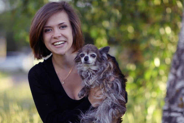 young girl with a small dog