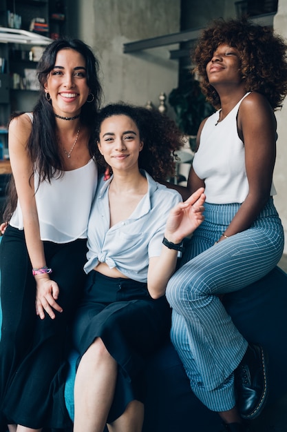 Young girls posing together and looking camera