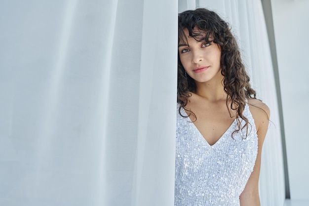 Young gorgeous woman in beautiful and stylish white wedding dress