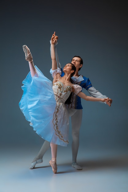 Young and graceful ballet dancers as cinderella fairytail characters