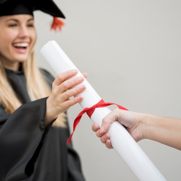 Young graduate getting her certificate