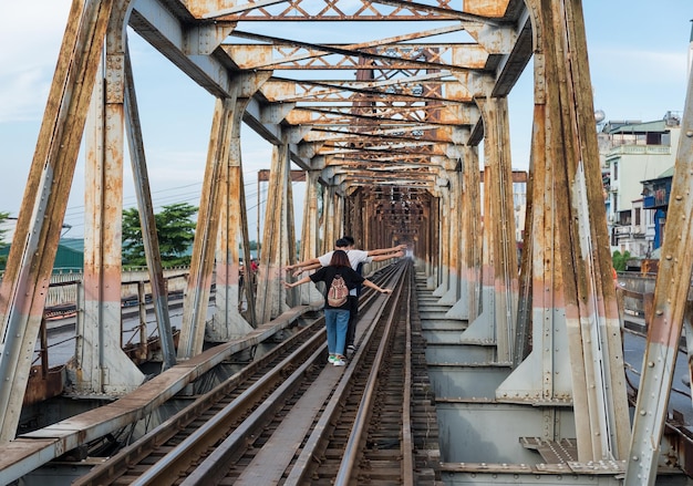 Young group enjoy running on railway track