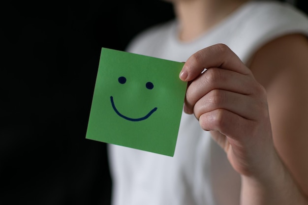 Young guy in black shirt poses smiling