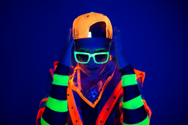 Young guy in creative costume with neon glow.