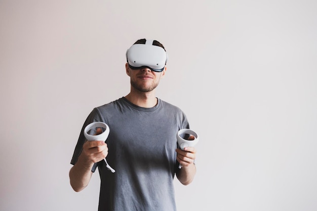 A young guy using virtual reality googles new modern technology headset