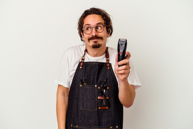 Young hairdresser caucasian man   dreaming of achieving goals and purposes