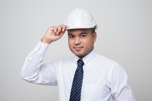 Young handsome asian civil engineer with a helmet