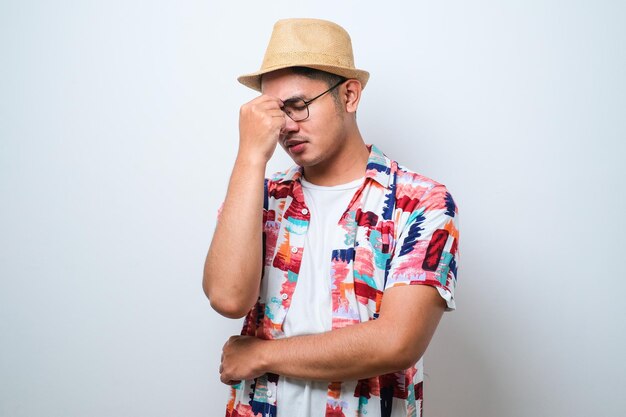 Young handsome asian man with hand on head for pain in head because stress Suffering migraine