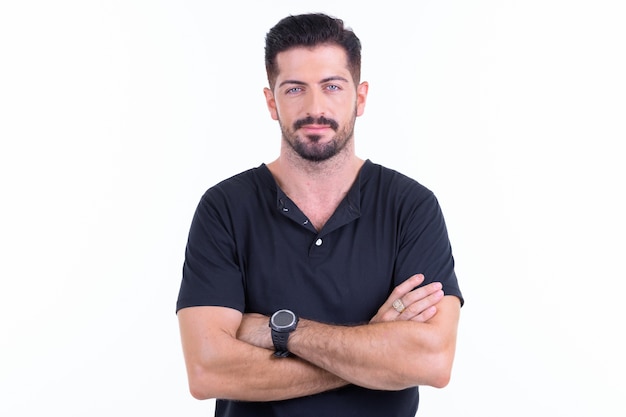  young handsome bearded man isolated against white wall