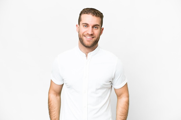 Young handsome blonde man over isolated white background laughing