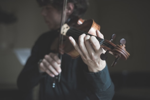 young handsome blonde violinist