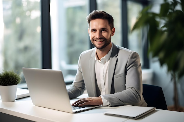 young handsome business man working with laptop in office