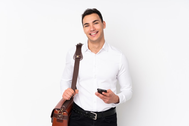 Young handsome businessman on keeping the arms crossed in frontal position