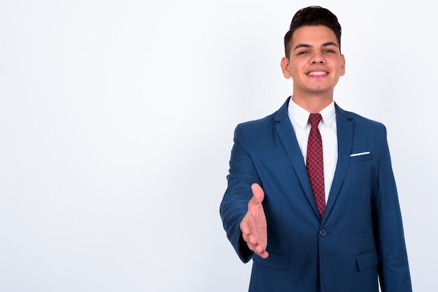 young handsome businessman wearing blue suit on white