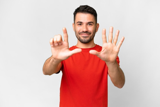 Young handsome caucasian man over isolated white background counting seven with fingers