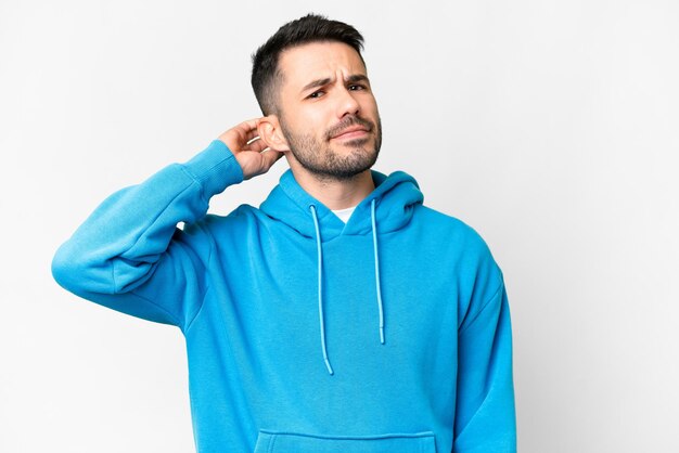 Young handsome caucasian man over isolated white background having doubts