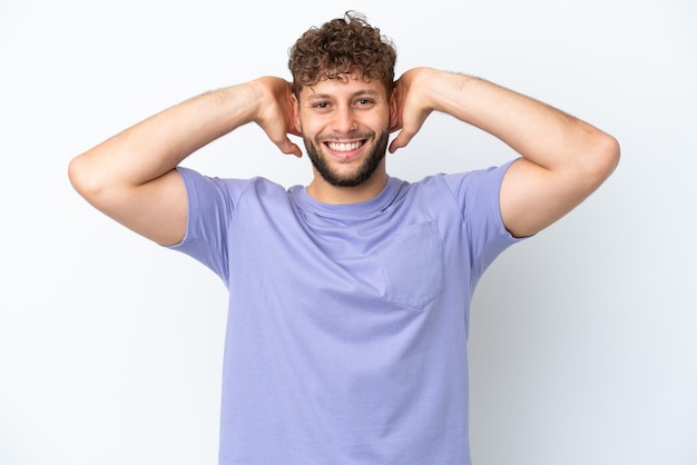 Young handsome caucasian man isolated on white background laughing