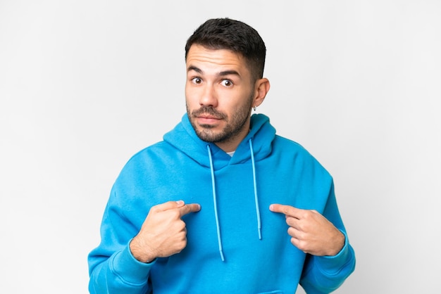 Young handsome caucasian man over isolated white background pointing to oneself