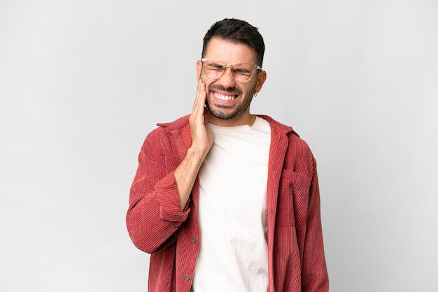 Young handsome caucasian man over isolated white background with toothache