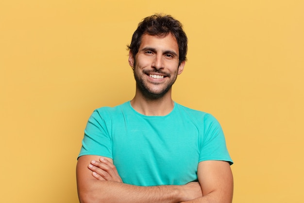 Young handsome indian man  happy and surprised expression