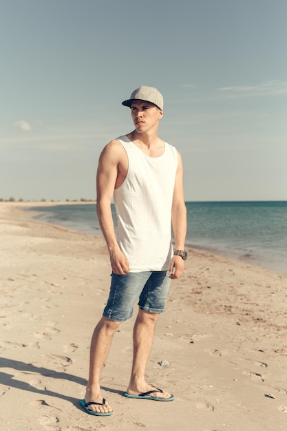 Young handsome man on the beach