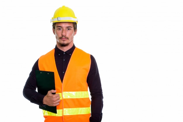 Young handsome man construction worker holding clipboard