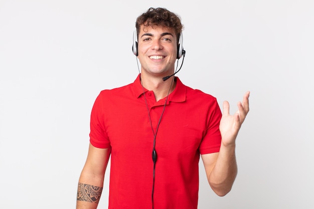 Young handsome man feeling happy, surprised realizing a solution or idea. telemarketer concept