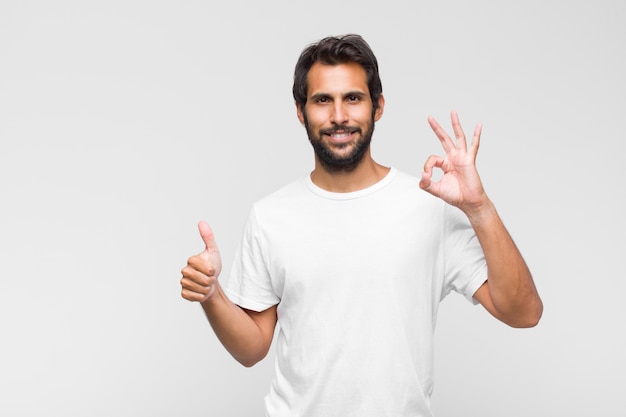 Young handsome man feeling happy