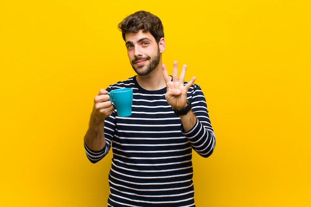 Young handsome man having a coffee