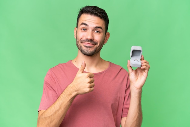 Young handsome man over isolated background